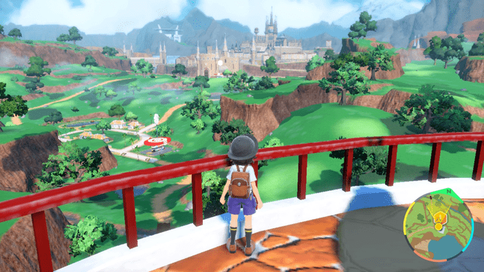 The player character looks out over the Paldea region from the top of a lighthouse