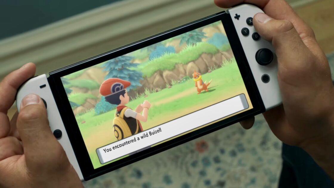 An off-screen photo of Pokémon Let's Go, Pikachu! and Let's Go, Eevee! running on the new Switch OLED model